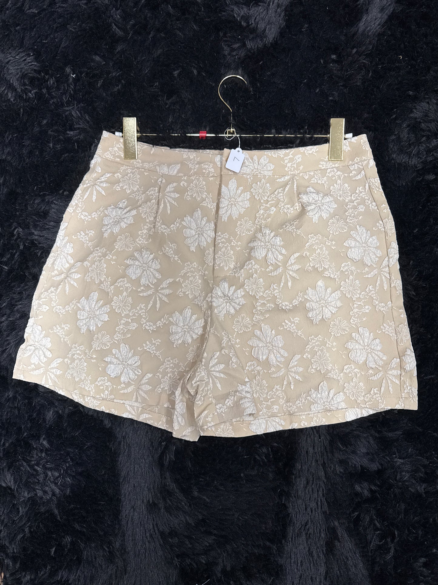 Tan and white shorts